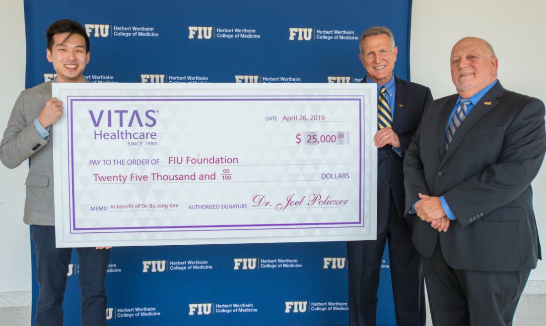 Dr. Kim, Dr. Robert Sackstein and Dr. Joel S. Policzer at the check presentation