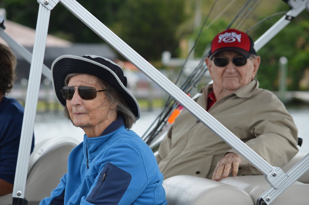 Fletcher's wife looks out on the water as she and her husband rest in the boat