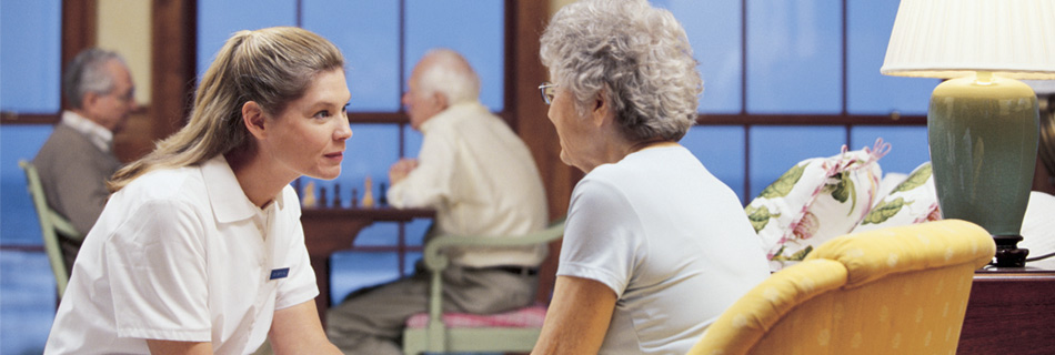 Hospice caretaker comforting hospice patient